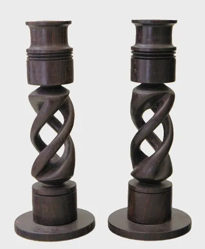 Paar ebbenhouten kandelaars